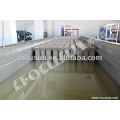 Block ice machine with brine tank